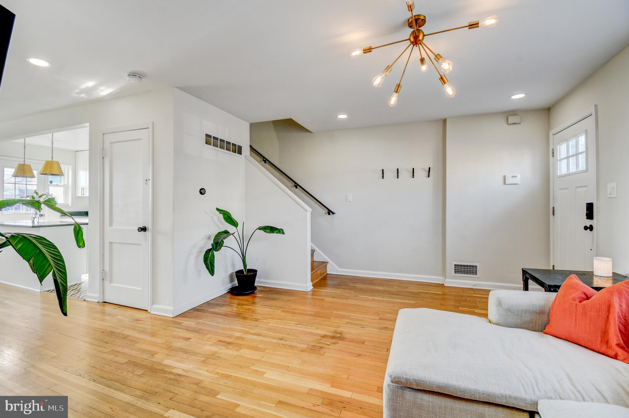 1371 Adams Street Northeast Washington, DC 20018 - Photo 7 of 34 a living room with furniture and a chandelier