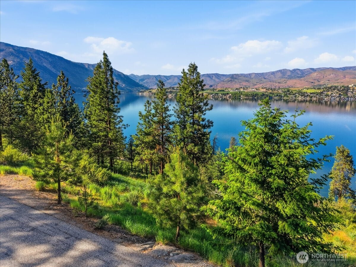 7376 Ridgeview Drive Chelan, WA 98816 - Photo 13 of 21 a view of a lake with houses in the back