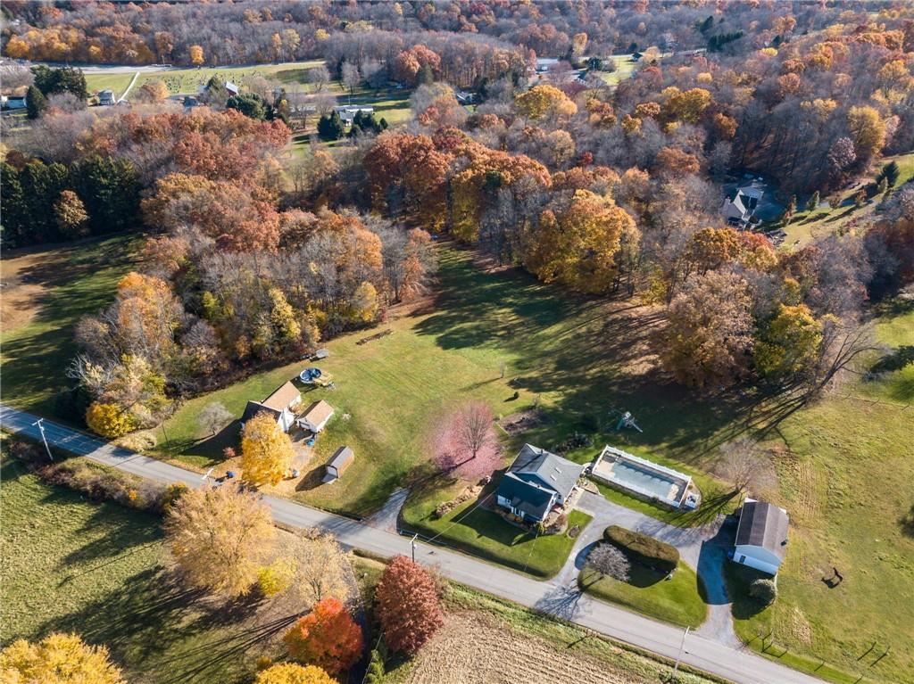 an aerial view of residential houses with outdoor space