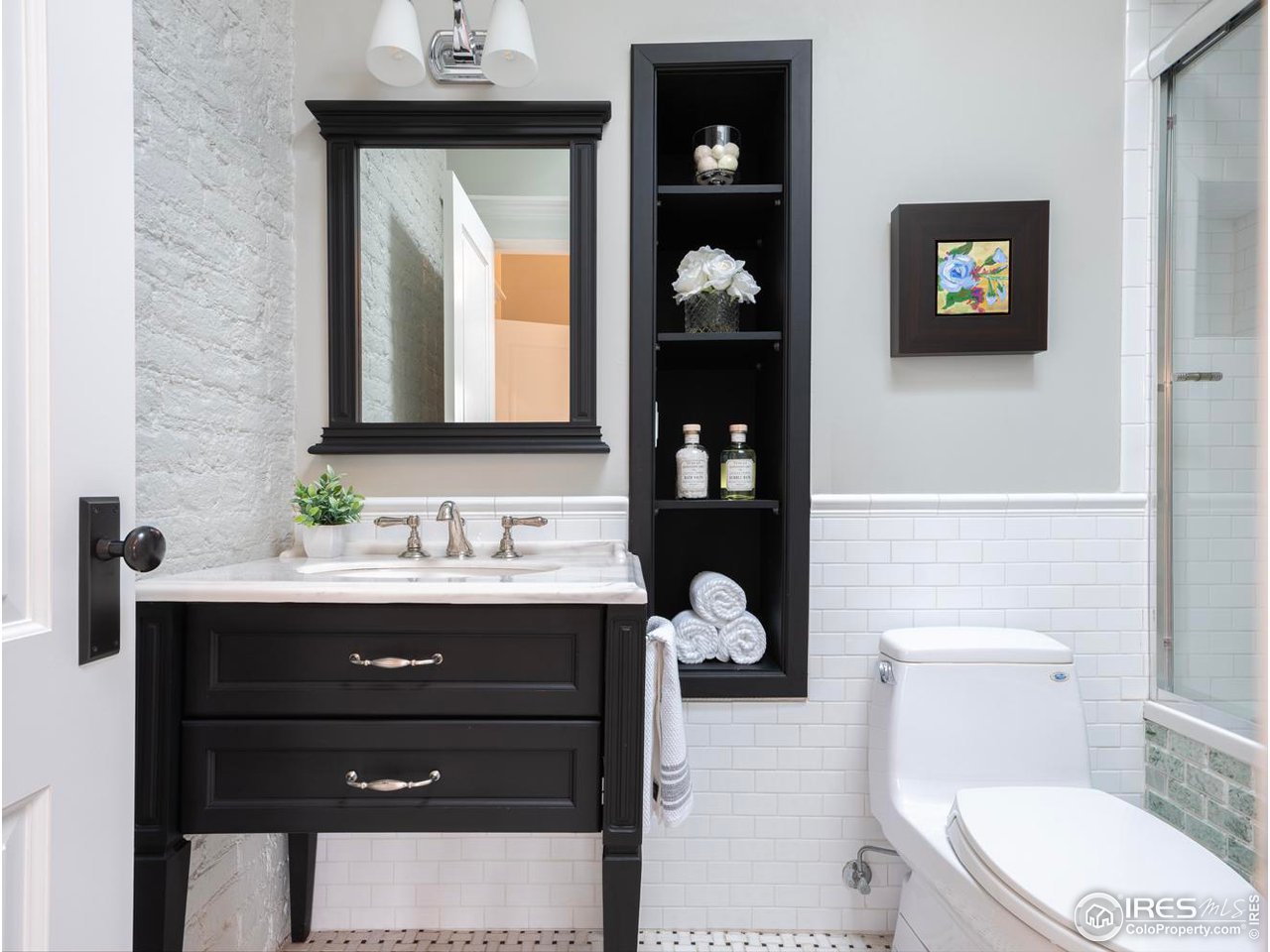 2303 Bluff Street Boulder, CO 80304 - Photo 18 of 40 a bathroom with a toilet sink vanity and mirror