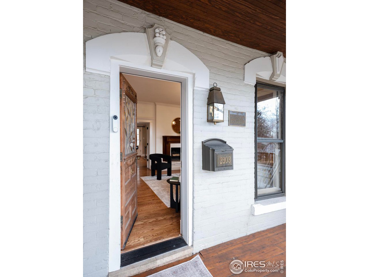 2303 Bluff Street Boulder, CO 80304 - Photo 2 of 40 a view of a living room with a rug and white walls