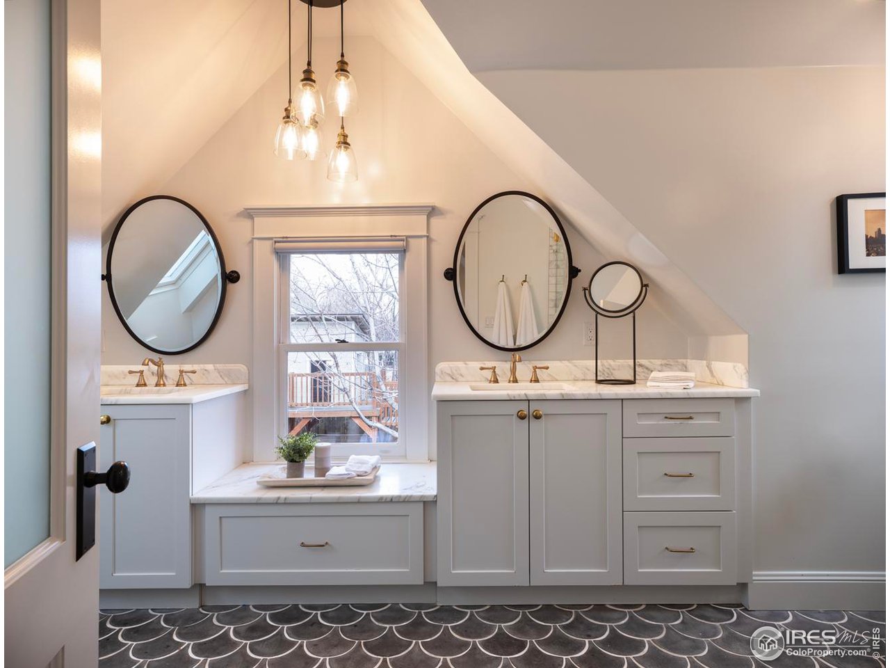 2303 Bluff Street Boulder, CO 80304 - Photo 21 of 40 a bathroom with a sink a mirror and a vanity