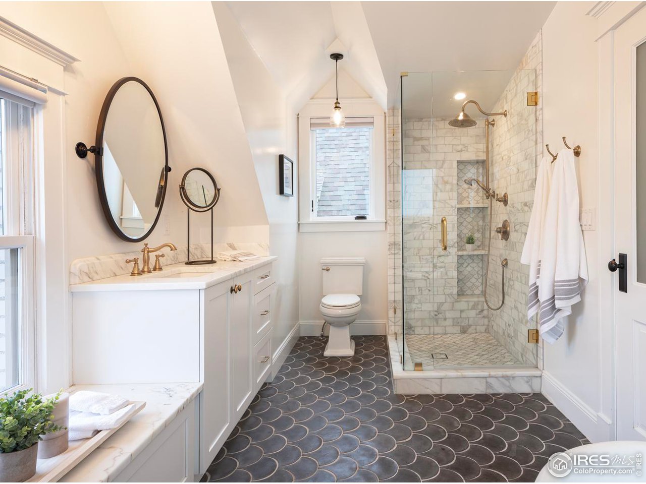 2303 Bluff Street Boulder, CO 80304 - Photo 22 of 40 a bathroom with a double vanity sink mirror and shower
