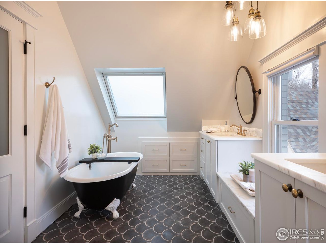 2303 Bluff Street Boulder, CO 80304 - Photo 23 of 40 a bathroom with a sink a toilet and a mirror