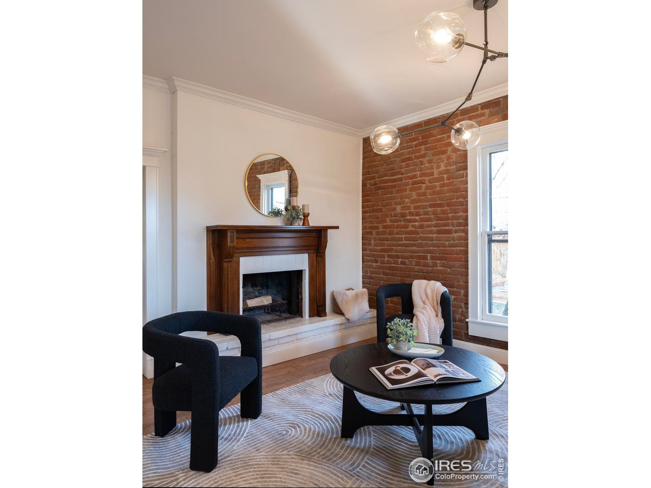 2303 Bluff Street Boulder, CO 80304 - Photo 5 of 40 a living room with furniture and a fireplace