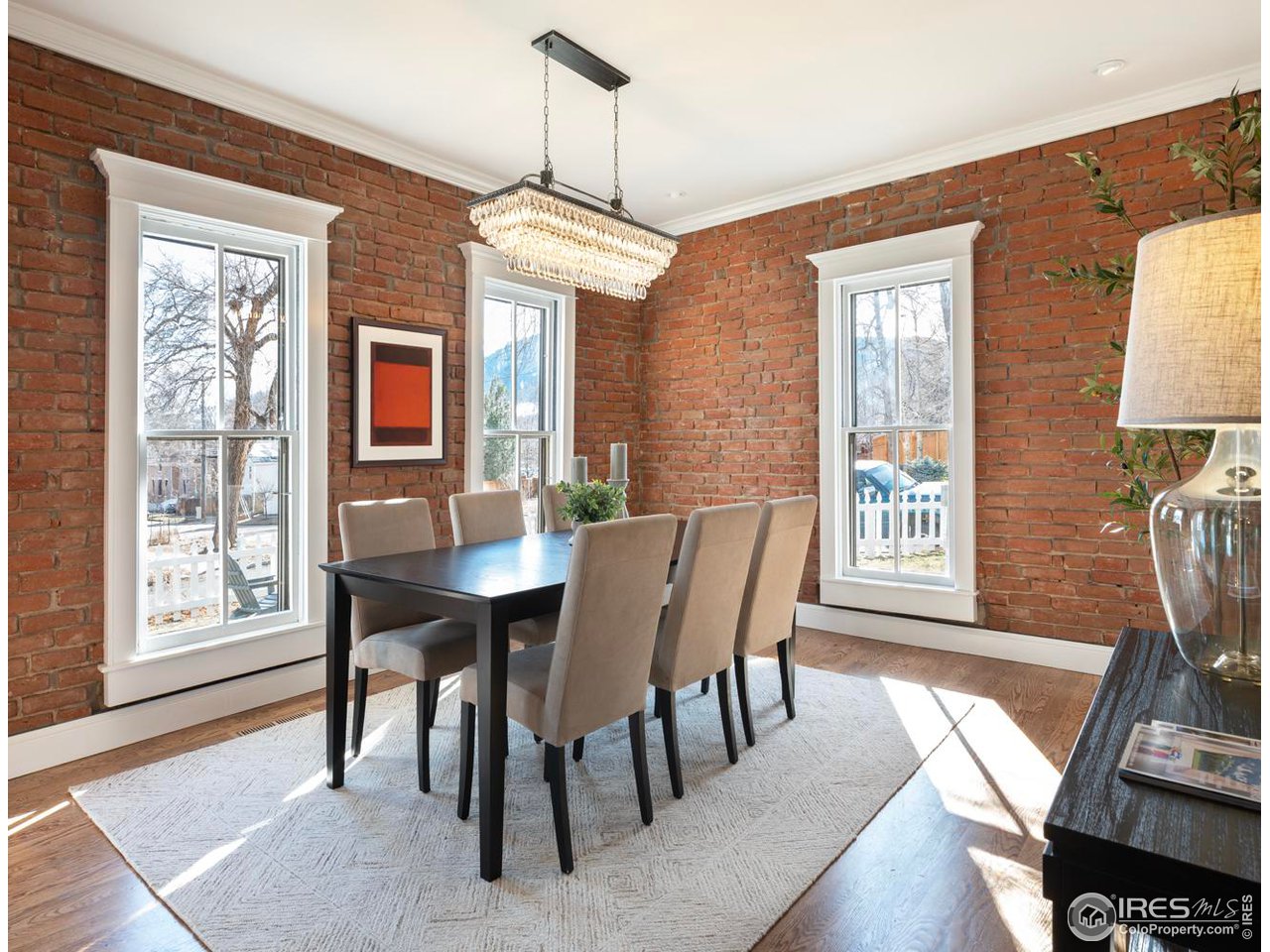 2303 Bluff Street Boulder, CO 80304 - Photo 6 of 40 a view of a dining room with furniture window and wooden floor