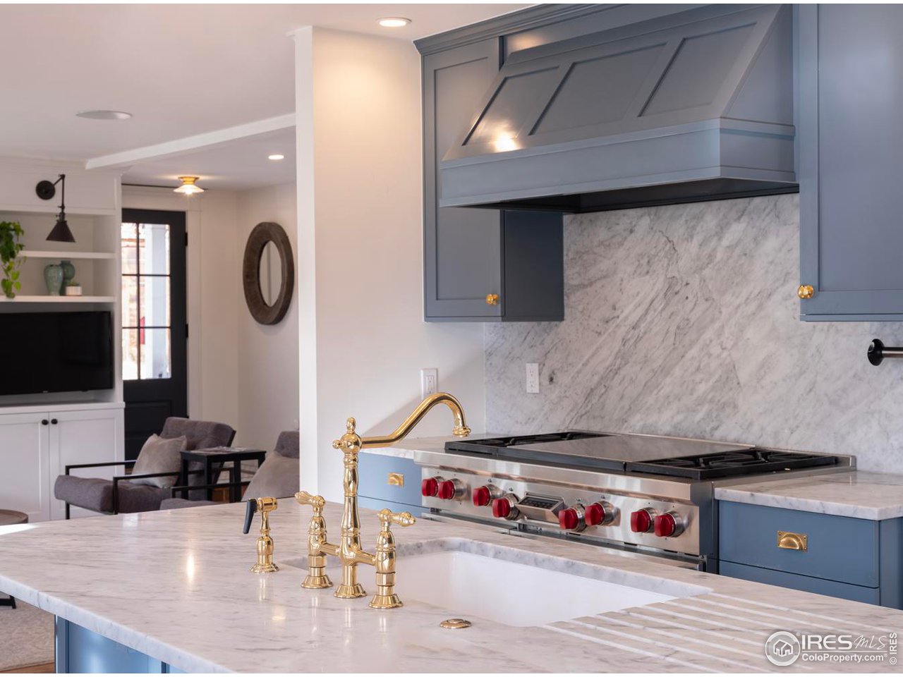 2303 Bluff Street Boulder, CO 80304 - Photo 8 of 40 a kitchen with kitchen island a stove and a sink