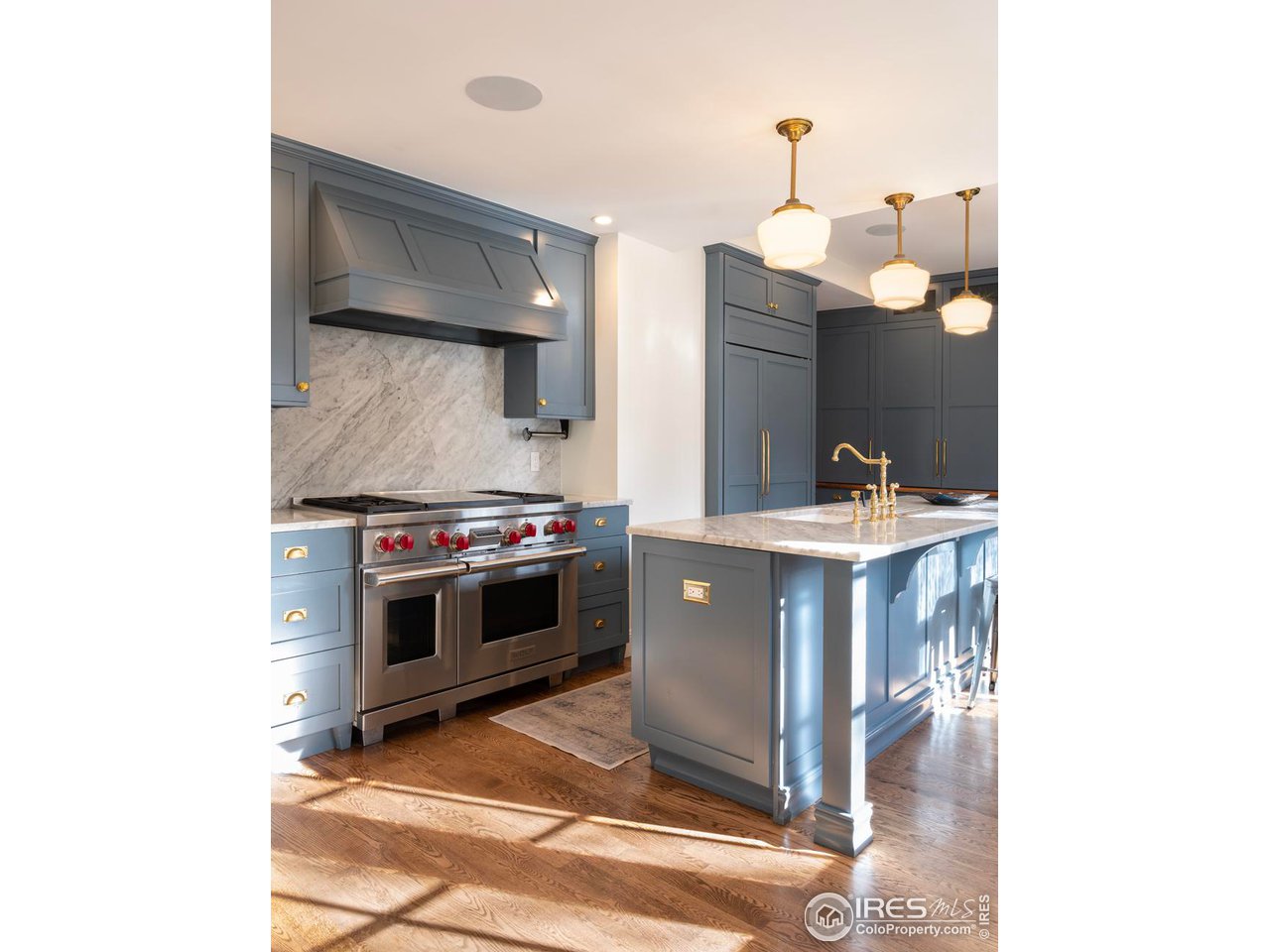 2303 Bluff Street Boulder, CO 80304 - Photo 9 of 40 a kitchen with a stove and a sink