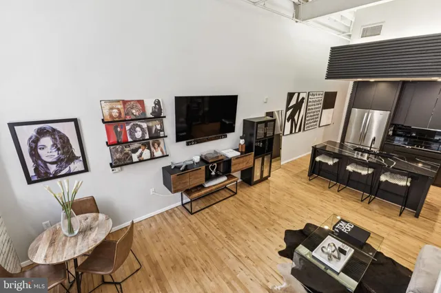 a bedroom with furniture and a flat screen tv