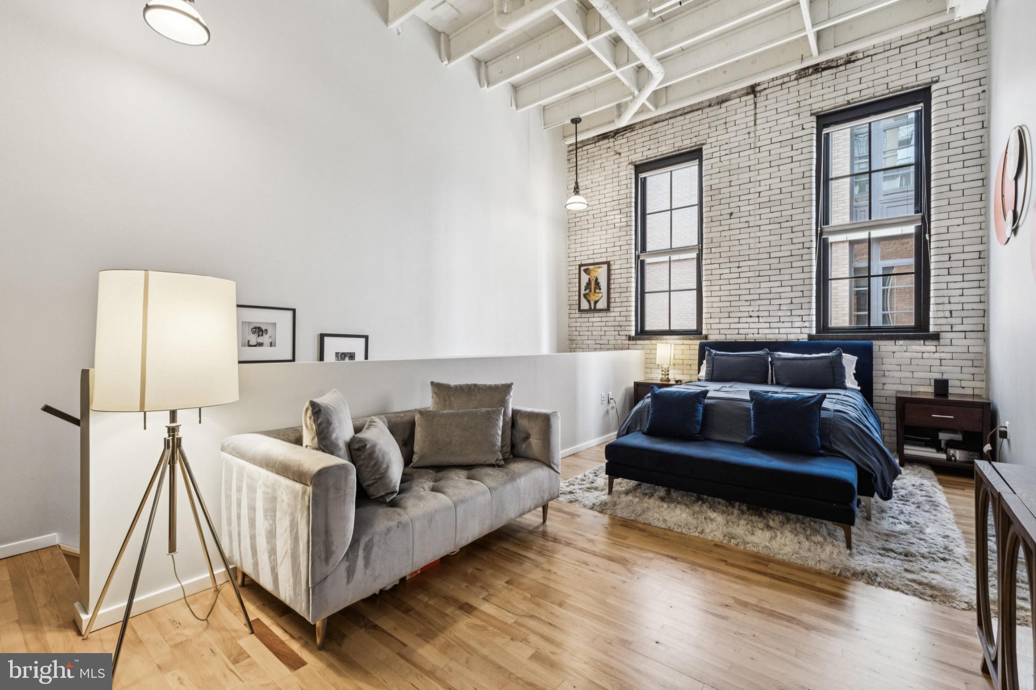 437 New York Avenue Northwest, Unit Y26 Washington, DC 20001 - Photo 8 of 15 a living room with furniture and a large window