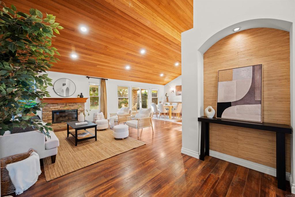 1062 Monterey Vista Way Encinitas, CA 92024 - Photo 12 of 70 a living room with fireplace furniture and a large window