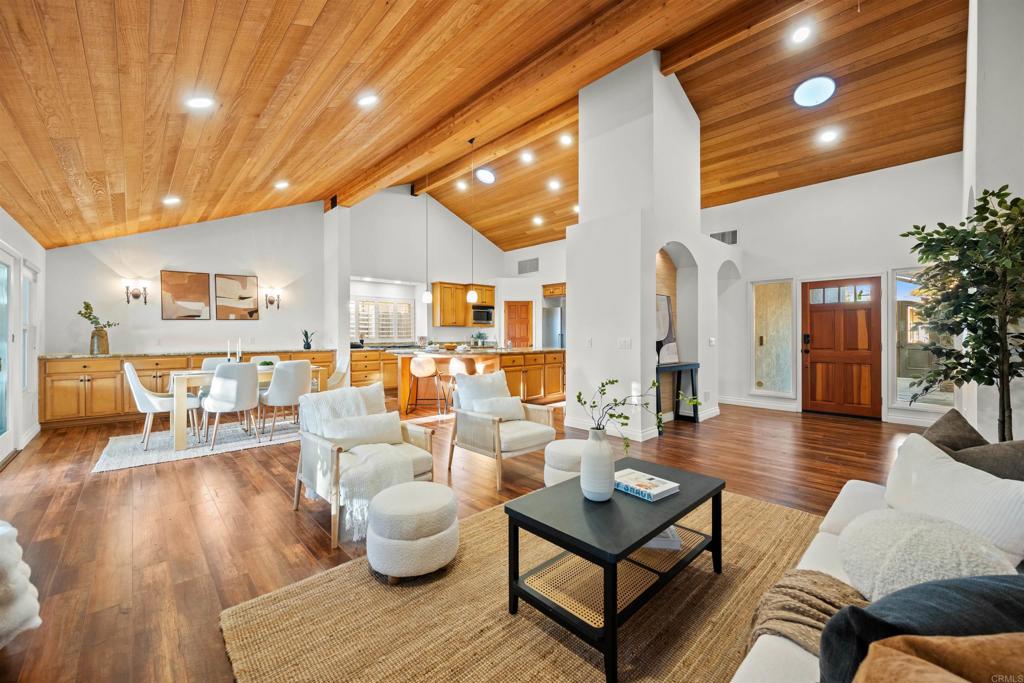 1062 Monterey Vista Way Encinitas, CA 92024 - Photo 13 of 70 a living room with furniture and wooden floor