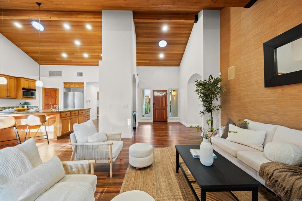 1062 Monterey Vista Way Encinitas, CA 92024 - Photo 14 of 70 a living room with furniture and wooden floor