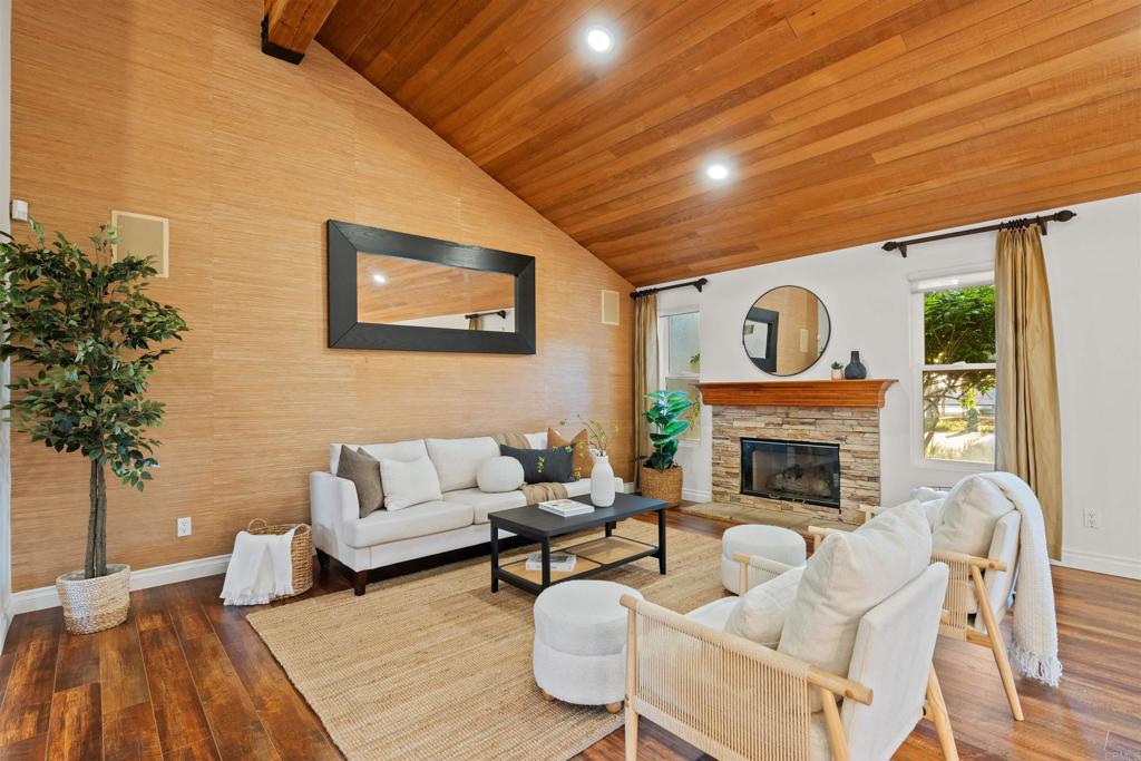 1062 Monterey Vista Way Encinitas, CA 92024 - Photo 17 of 70 a living room with furniture and a fireplace
