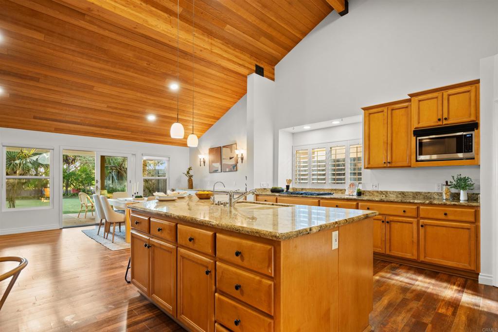 1062 Monterey Vista Way Encinitas, CA 92024 - Photo 27 of 70 a kitchen with sink stove and cabinets