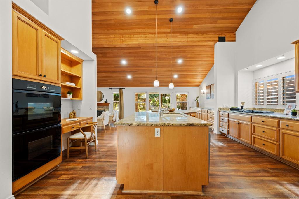 1062 Monterey Vista Way Encinitas, CA 92024 - Photo 28 of 70 a kitchen with stainless steel appliances granite countertop a stove a sink and a refrigerator