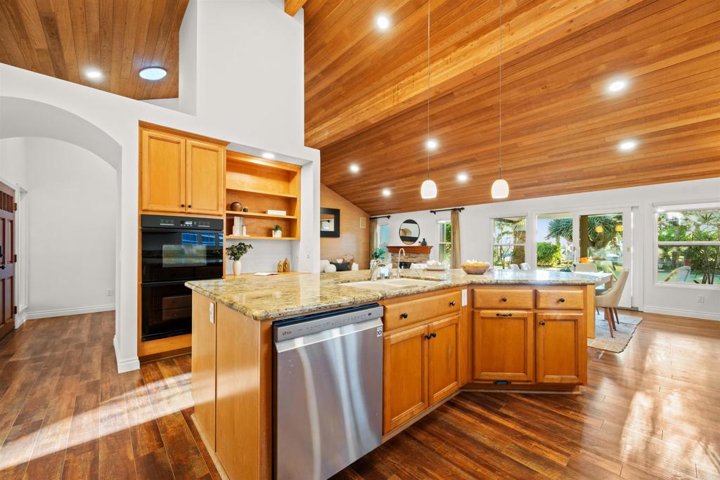 1062 Monterey Vista Way Encinitas, CA 92024 - Photo 29 of 70 a kitchen with stainless steel appliances granite countertop a sink and cabinets