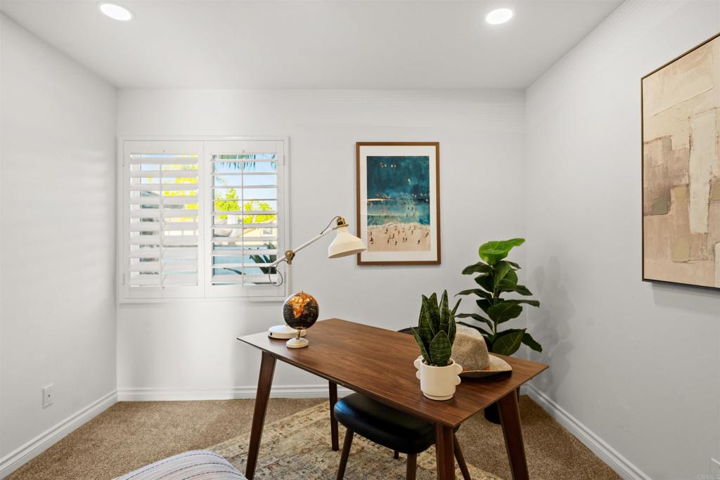 1062 Monterey Vista Way Encinitas, CA 92024 - Photo 39 of 70 a view of a workspace room with furniture and wooden floor