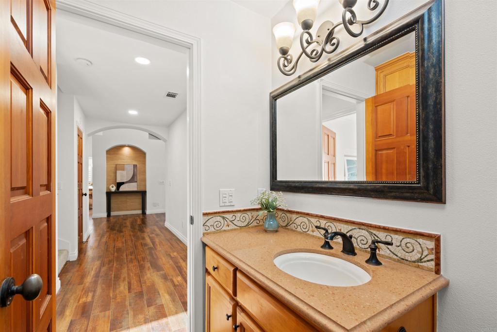 1062 Monterey Vista Way Encinitas, CA 92024 - Photo 41 of 70 a bathroom with a sink and a mirror