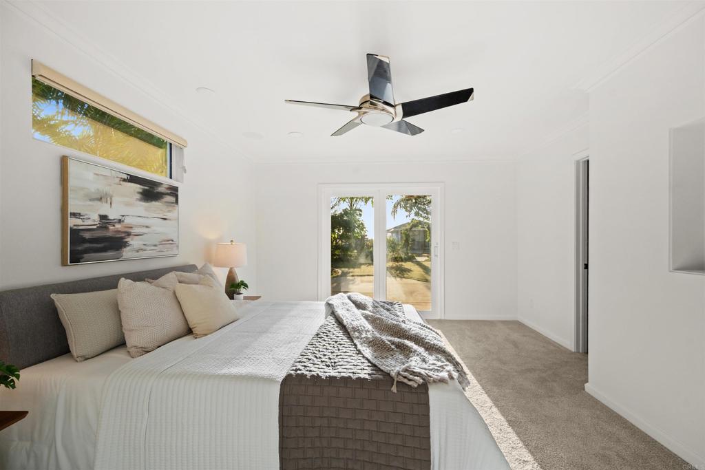 1062 Monterey Vista Way Encinitas, CA 92024 - Photo 44 of 70 a bedroom with a bed and a window