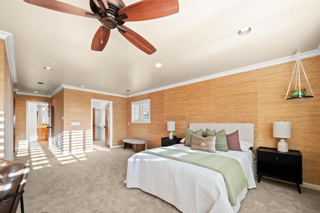 1062 Monterey Vista Way Encinitas, CA 92024 - Photo 52 of 70 a bedroom with a bed and wooden floor