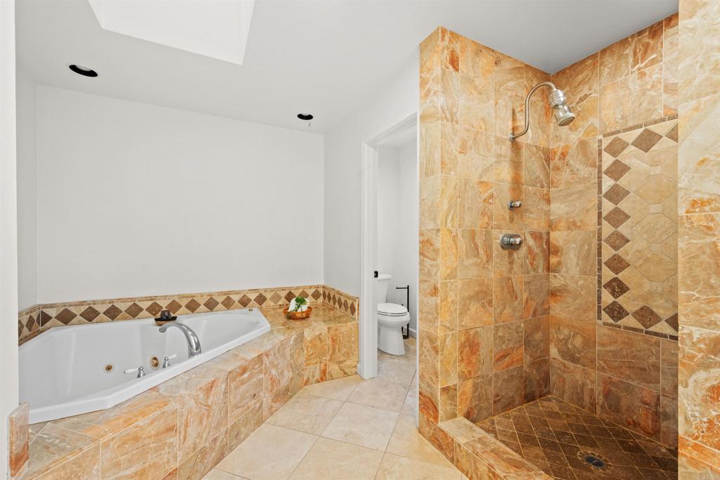 1062 Monterey Vista Way Encinitas, CA 92024 - Photo 57 of 70 a bathroom with a bathtub and shower