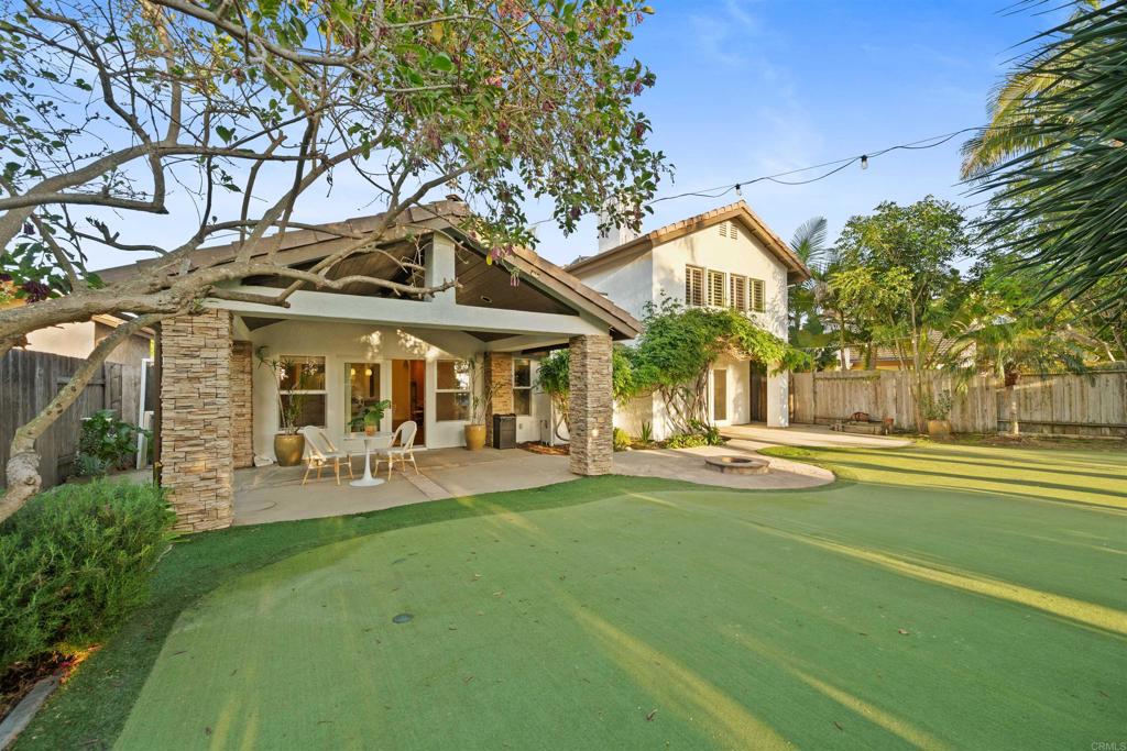1062 Monterey Vista Way Encinitas, CA 92024 - Photo 65 of 70 a front view of a house with swimming pool having outdoor seating