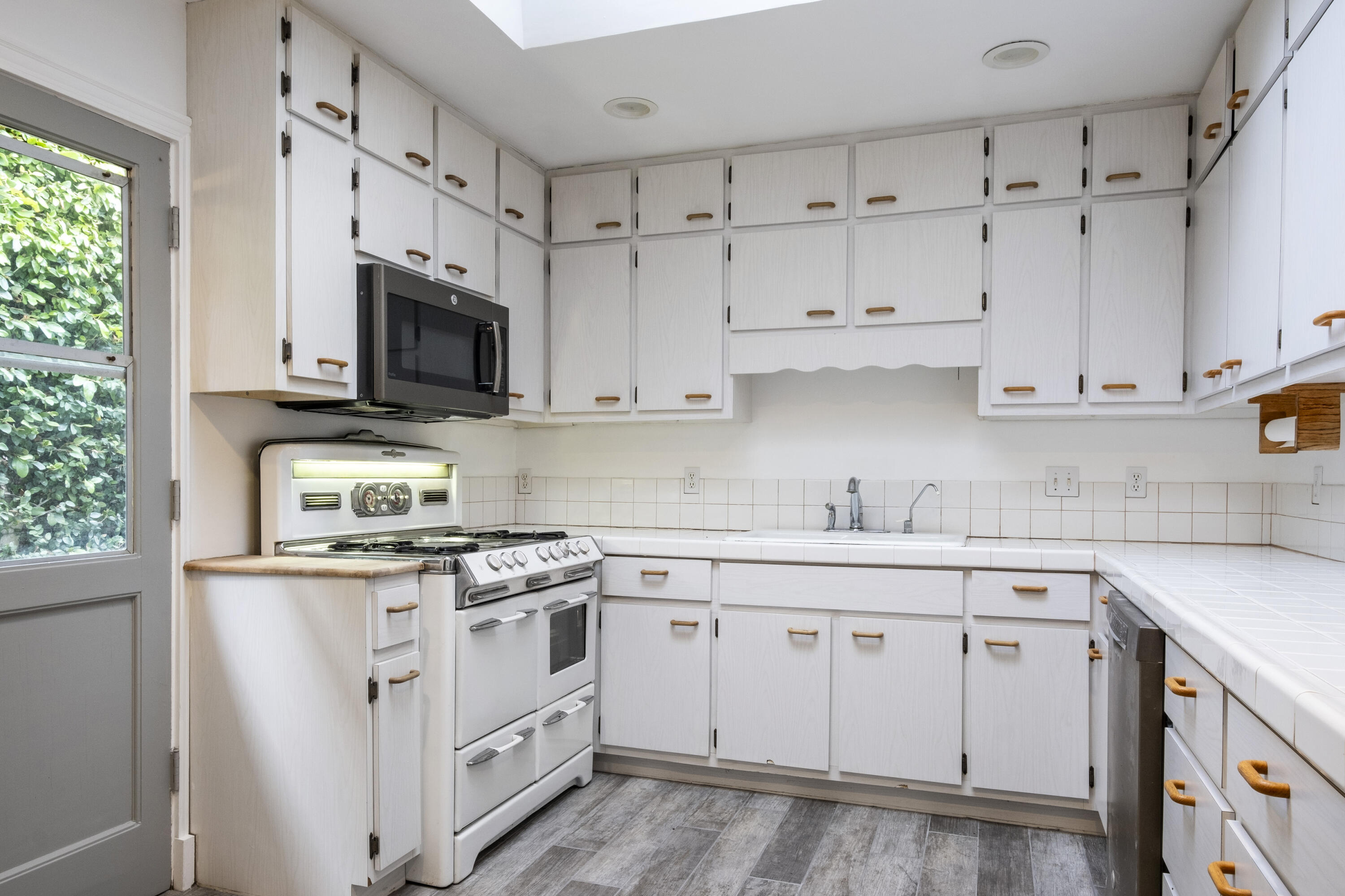 2530 Murrell Road Santa Barbara, CA 93109 - Photo 5 of 19 a kitchen with cabinets stainless steel appliances a sink and a window