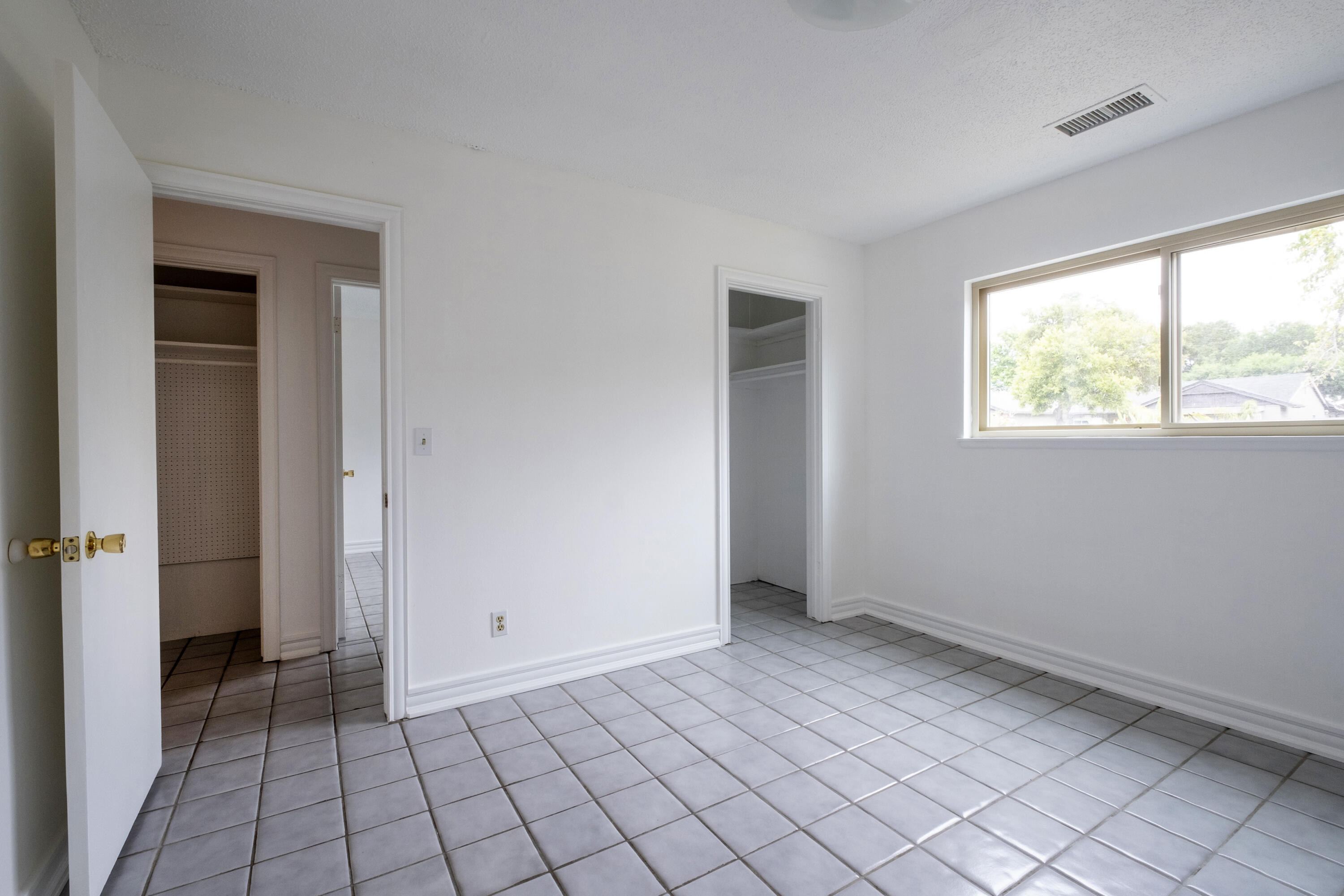 2530 Murrell Road Santa Barbara, CA 93109 - Photo 9 of 19 a view of an empty room and window