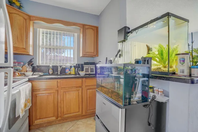 a kitchen with stainless steel appliances granite countertop a sink and a cabinets