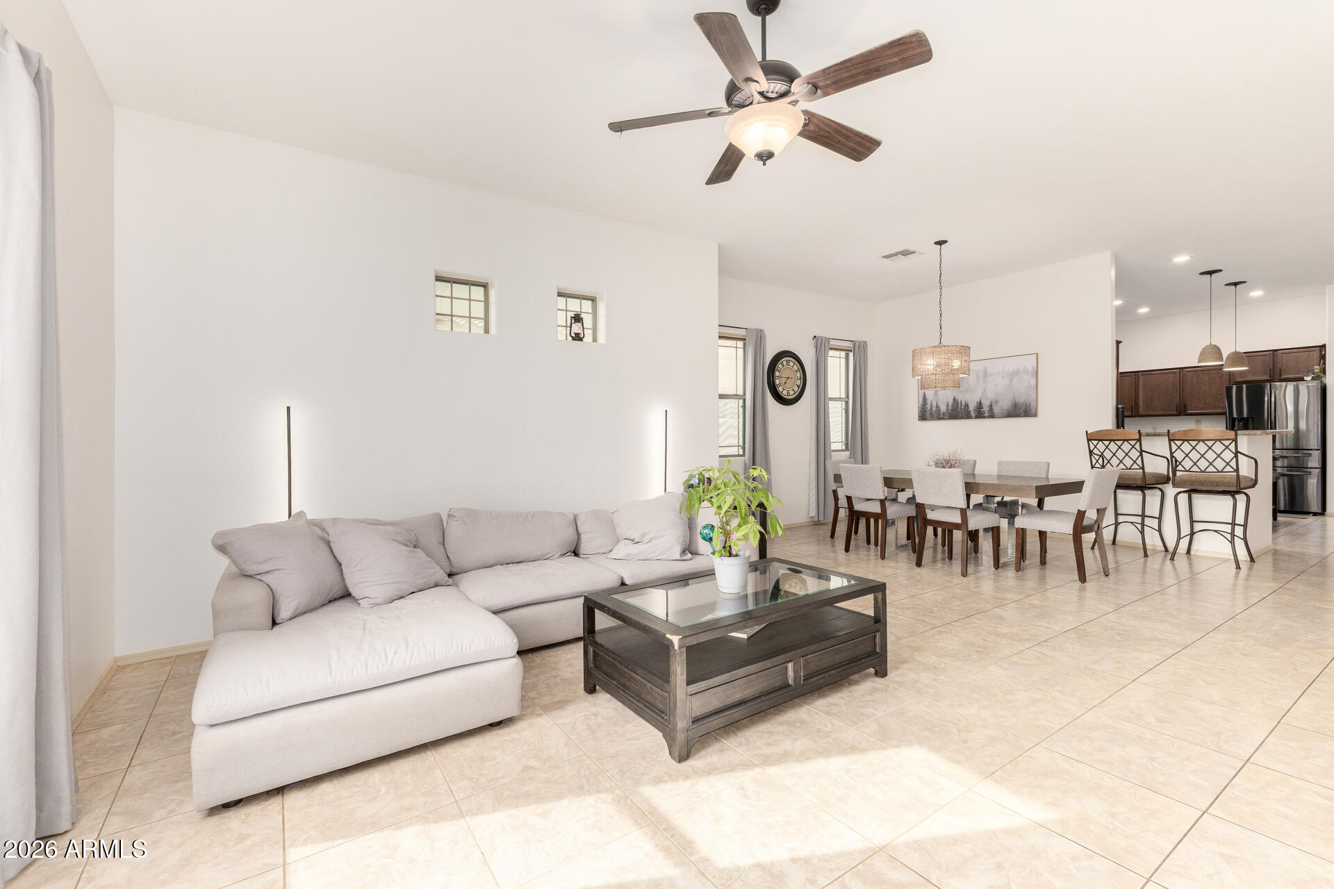 6202 East McKellips Road, Unit 189 Mesa, AZ 85215 - Photo 11 of 33 a living room with furniture kitchen view and a chandelier