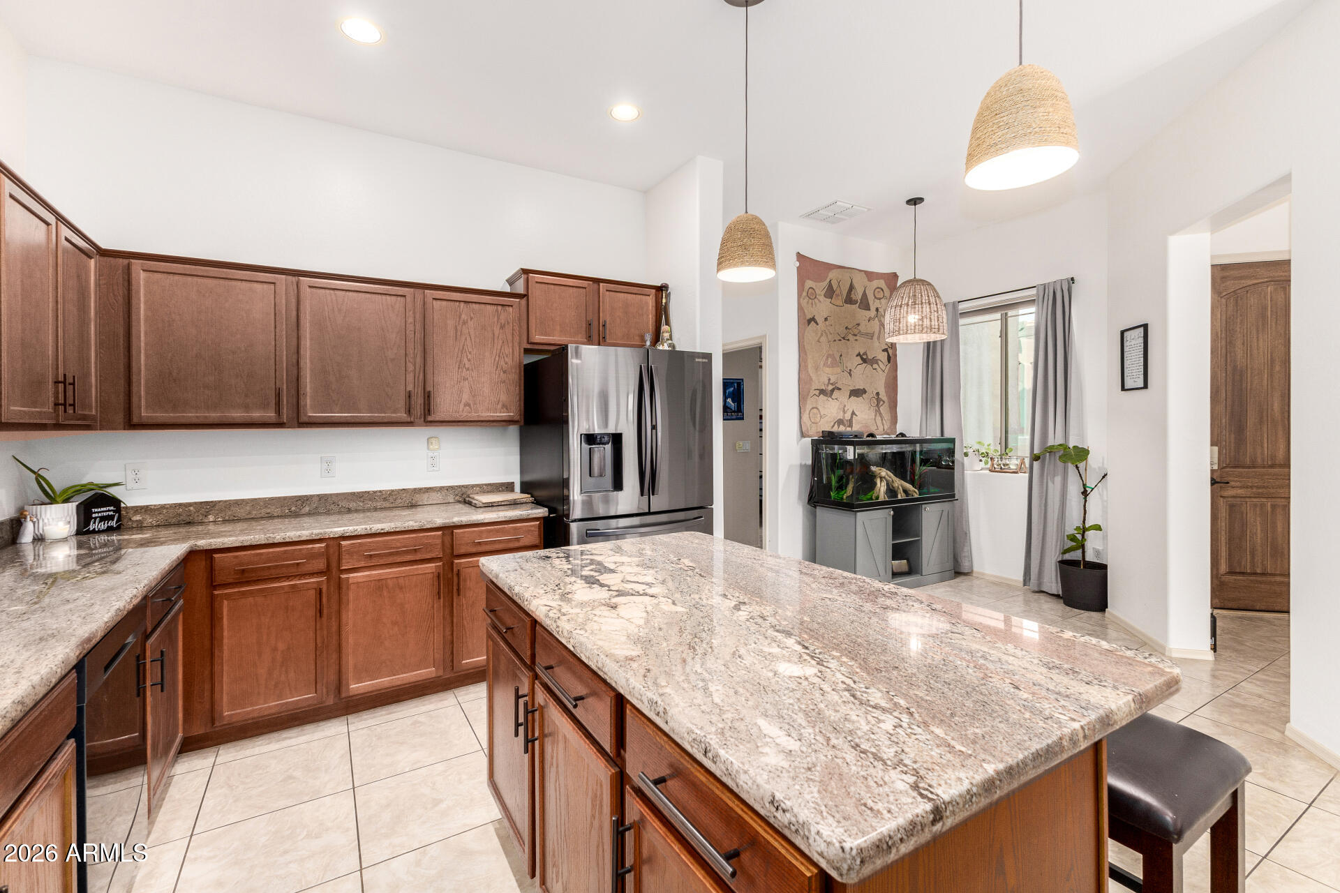 6202 East McKellips Road, Unit 189 Mesa, AZ 85215 - Photo 18 of 33 a kitchen with stainless steel appliances granite countertop a sink refrigerator and cabinets