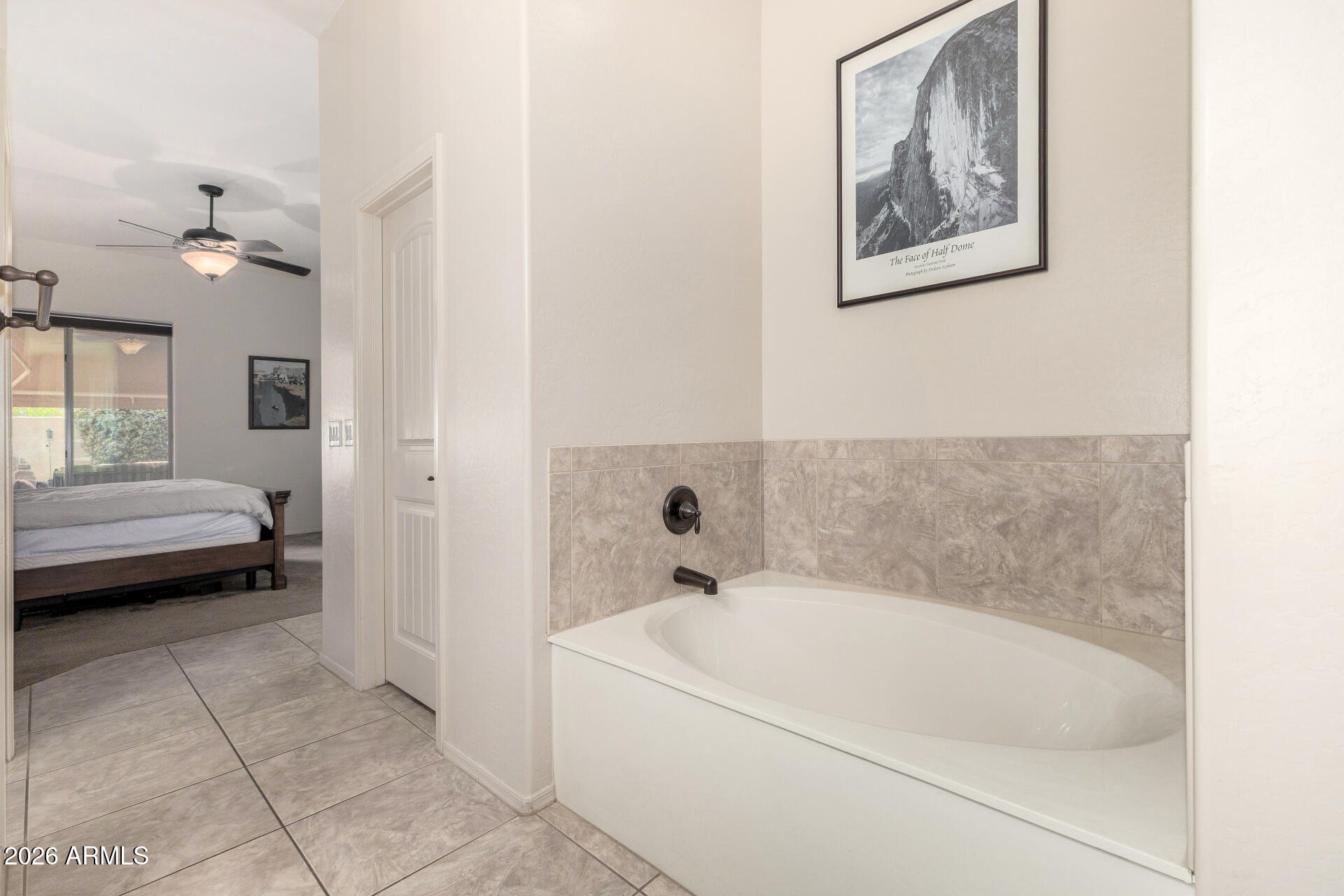 6202 East McKellips Road, Unit 189 Mesa, AZ 85215 - Photo 21 of 33 a bathroom with a tub and a view of bathroom