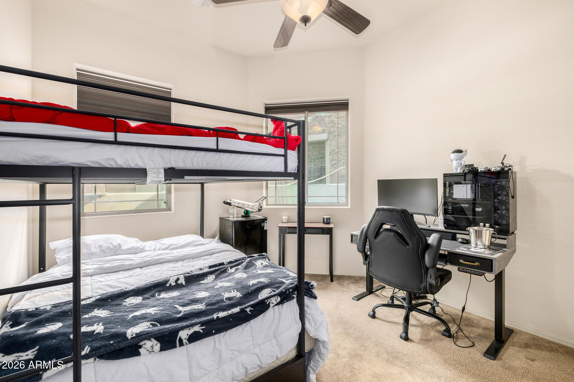 6202 East McKellips Road, Unit 189 Mesa, AZ 85215 - Photo 23 of 33 a bedroom with a bed and a chair