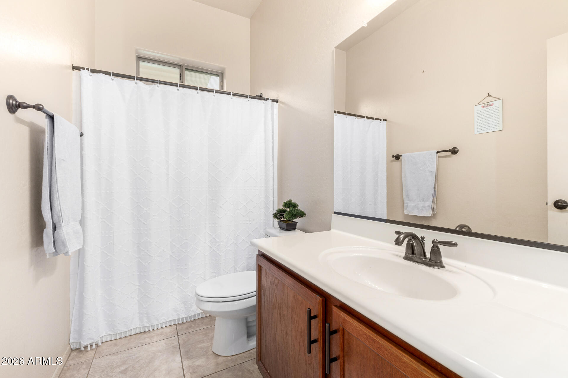 6202 East McKellips Road, Unit 189 Mesa, AZ 85215 - Photo 26 of 33 a bathroom with a sink and a mirror