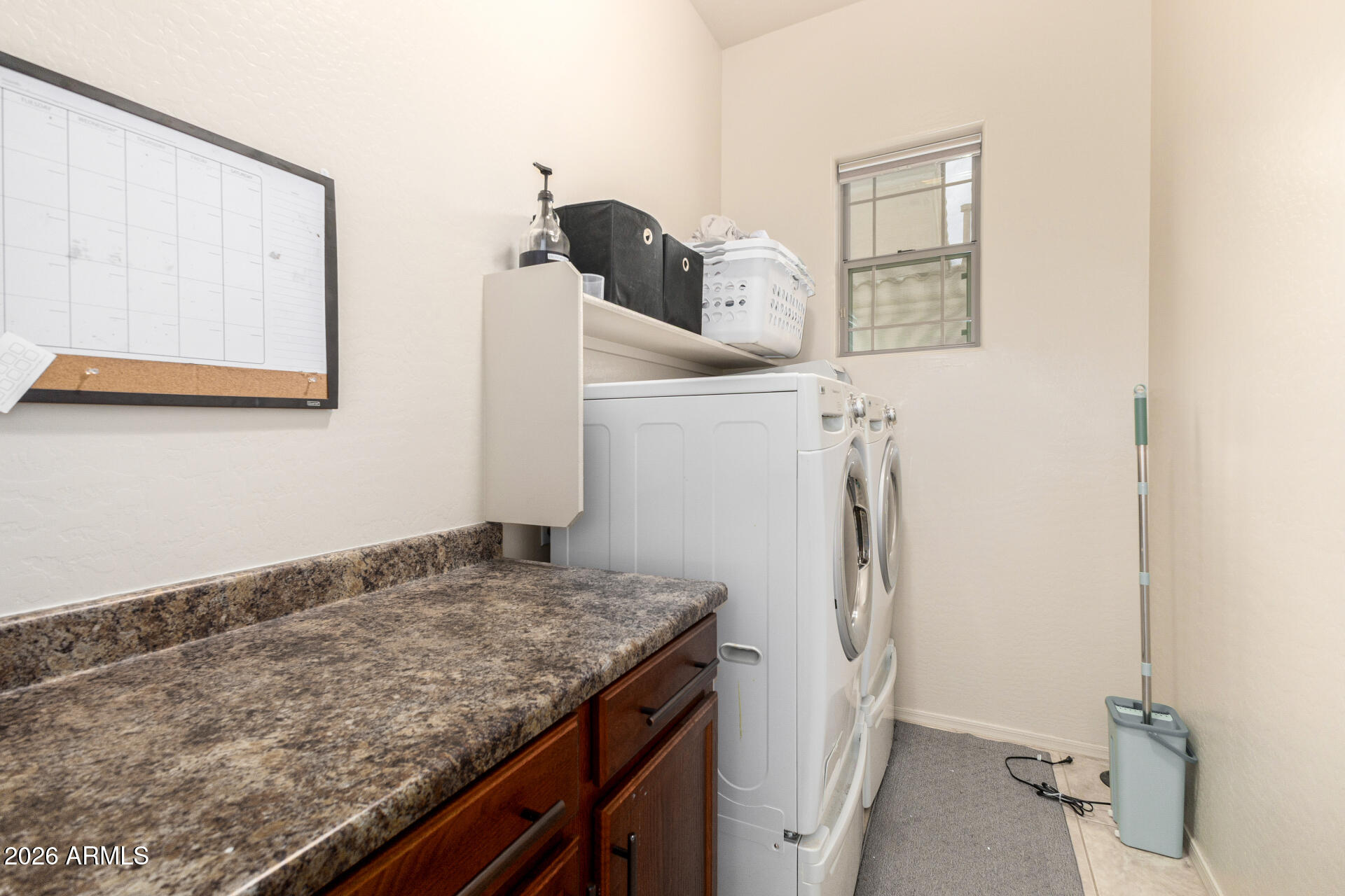 6202 East McKellips Road, Unit 189 Mesa, AZ 85215 - Photo 27 of 33 a bathroom with a granite countertop sink and a stove