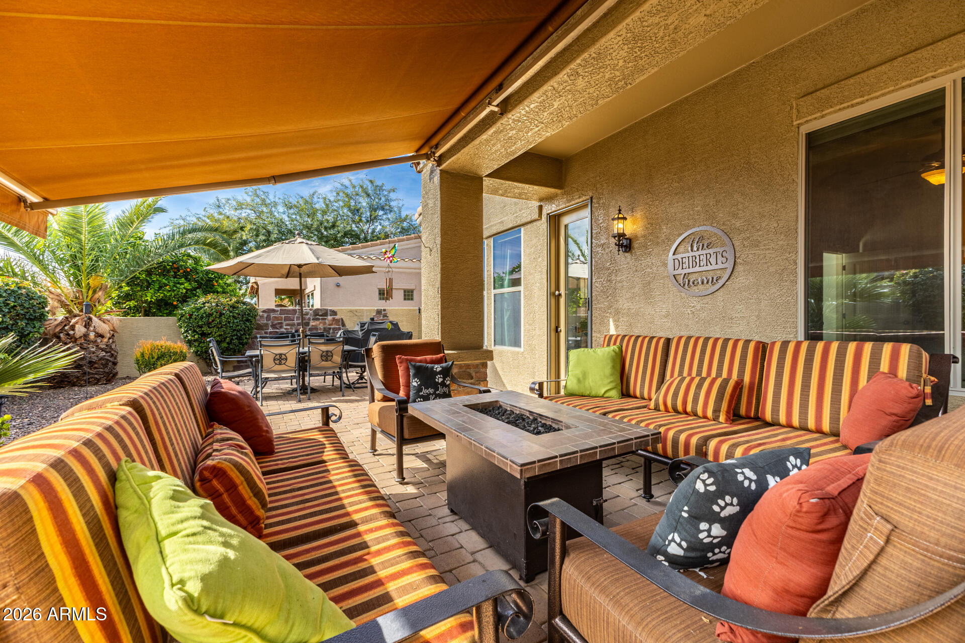 6202 East McKellips Road, Unit 189 Mesa, AZ 85215 - Photo 30 of 33 a view of a patio with couches chairs and a table and chairs