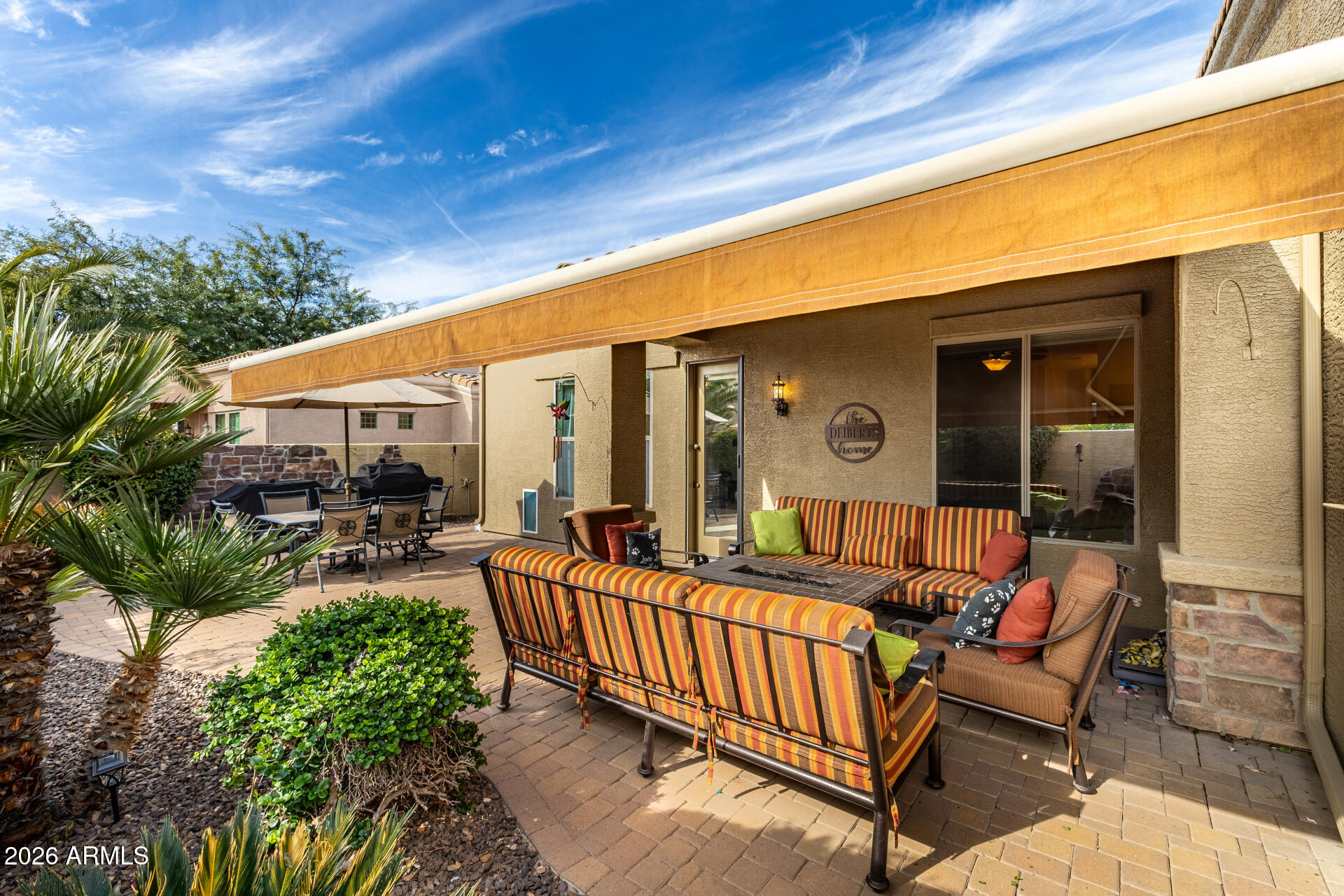 6202 East McKellips Road, Unit 189 Mesa, AZ 85215 - Photo 31 of 33 a view of a patio with a table and chairs