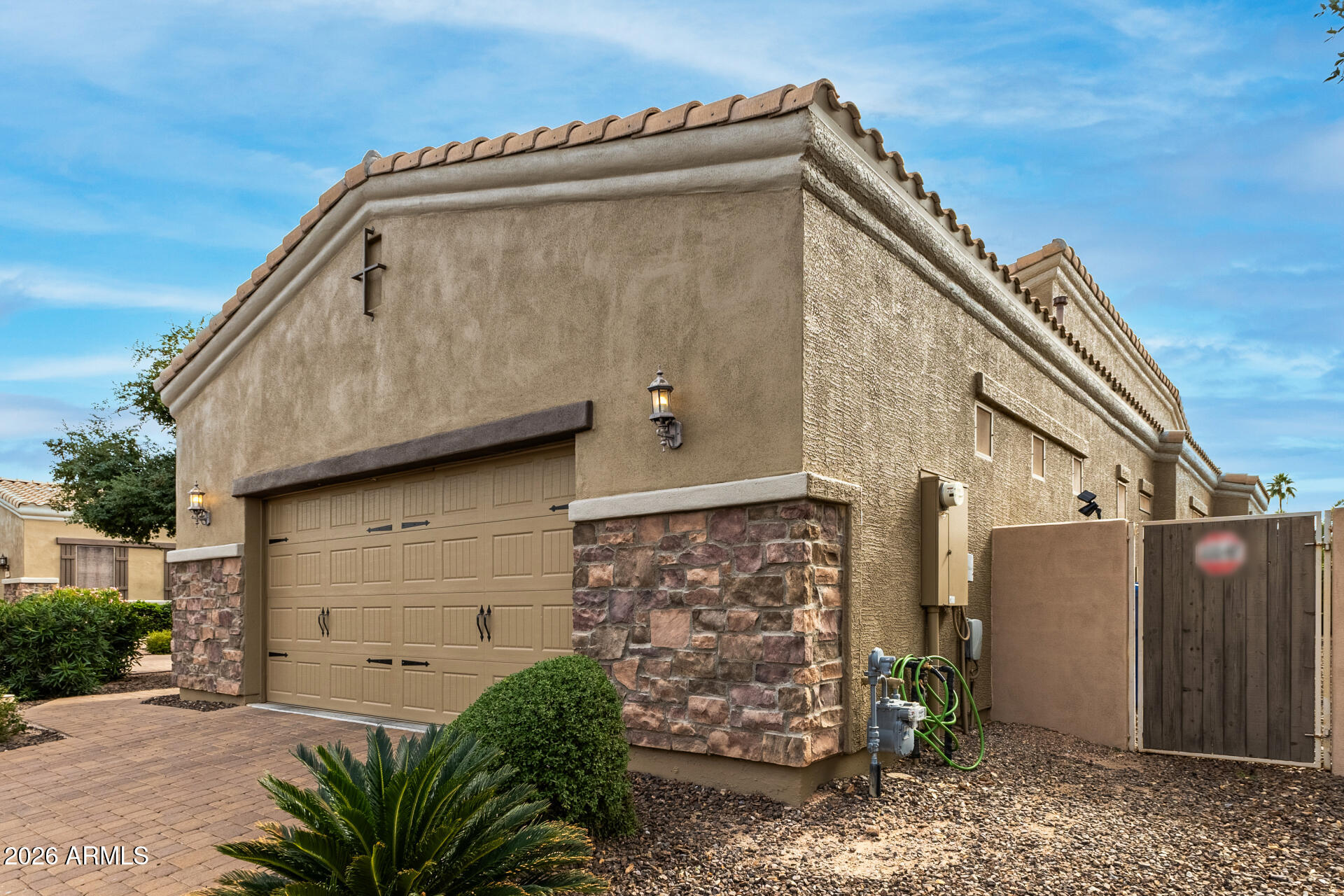 6202 East McKellips Road, Unit 189 Mesa, AZ 85215 - Photo 4 of 33 a front view of a house with garden