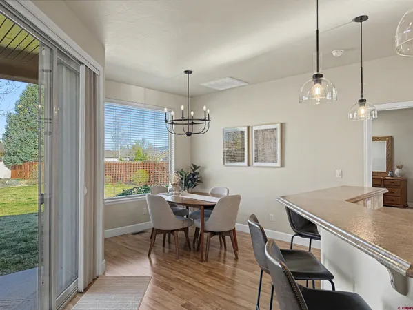 a view of a dining room with furniture window and outside view