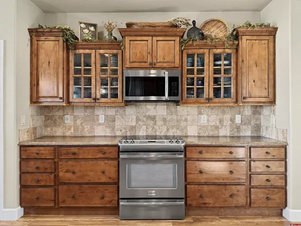 a kitchen with a stove oven and cabinets