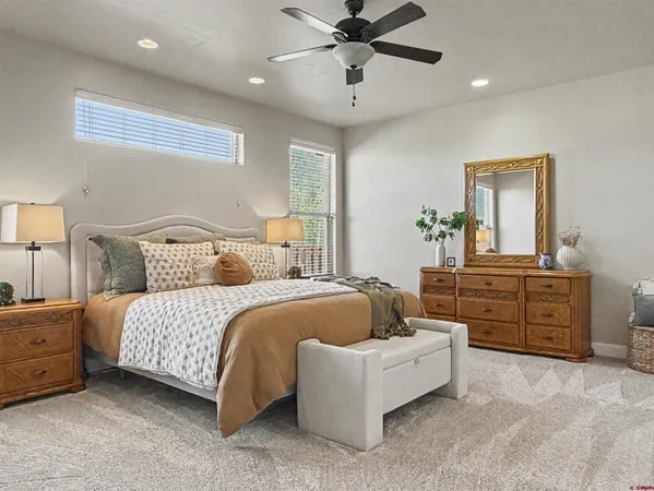 a bedroom with a bed and a dresser