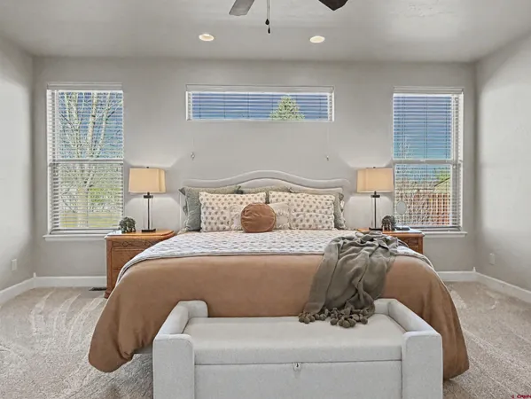 a bedroom with bed and window