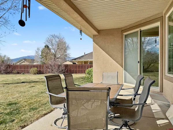 a view of balcony with wooden floor and outdoor seating
