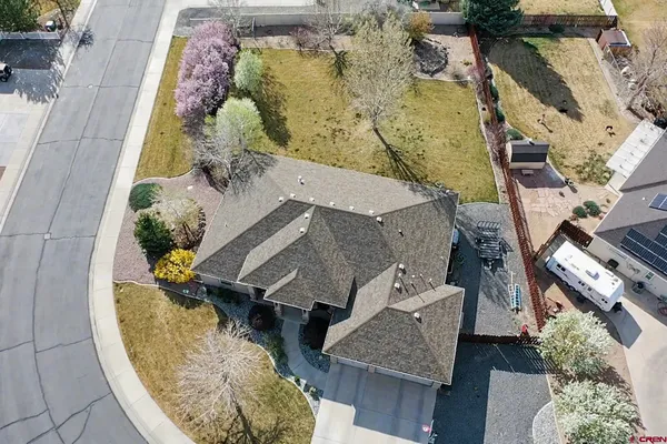 an aerial view of a house with a swimming pool