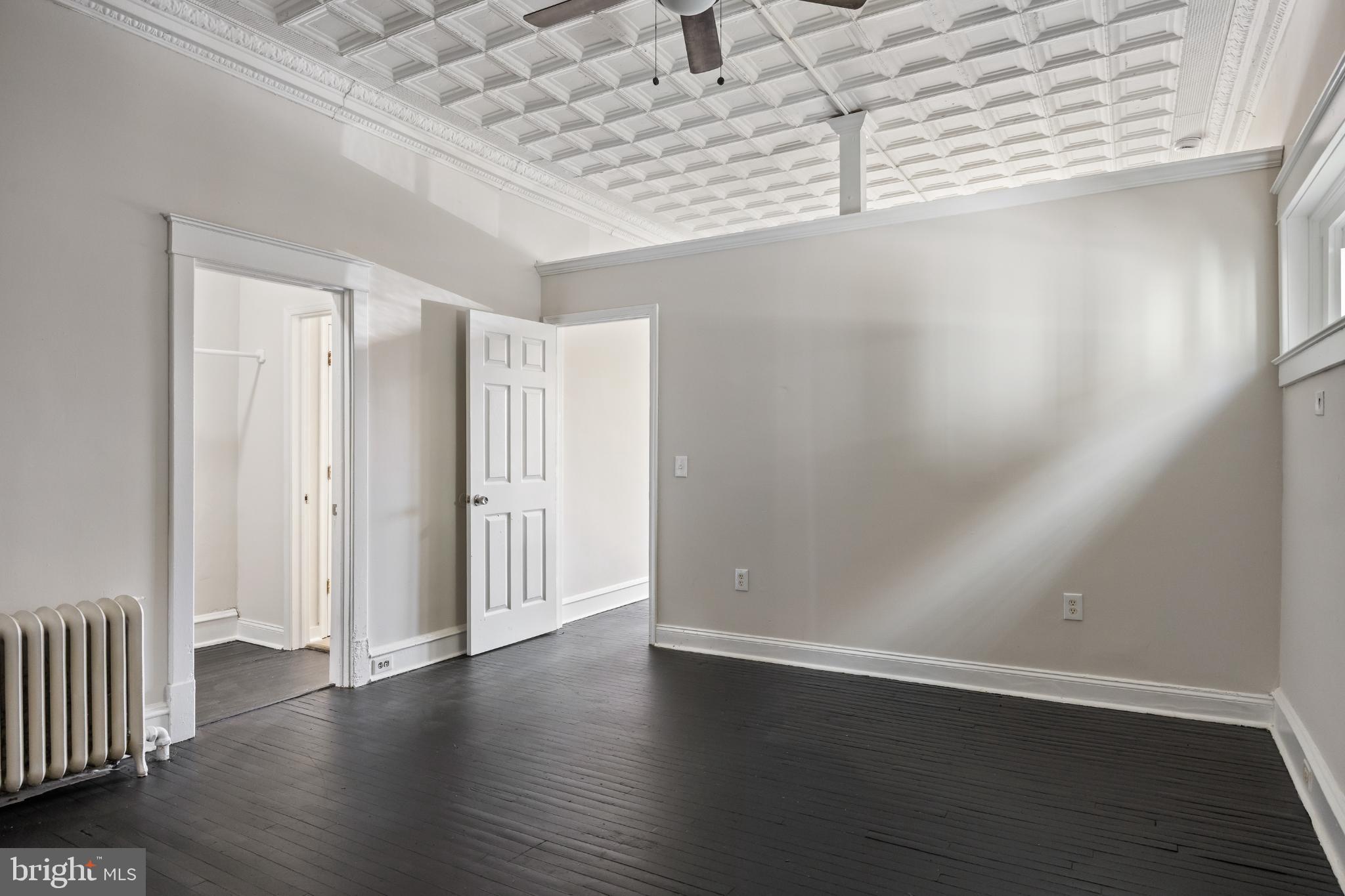 2003 Edgmont Avenue Chester, PA 19013 - Photo 12 of 40 an empty room with wooden floor and windows