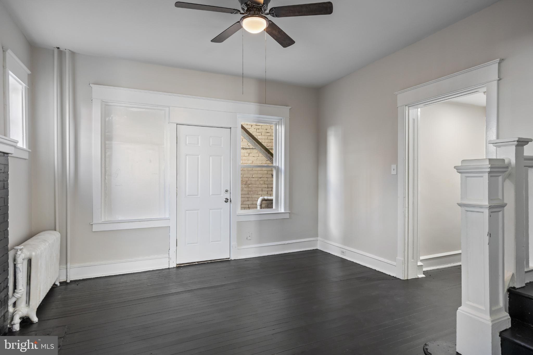 2003 Edgmont Avenue Chester, PA 19013 - Photo 16 of 40 wooden floor in an empty room with a window