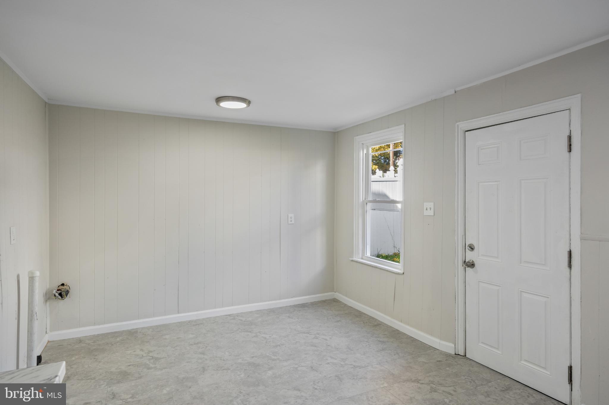 2003 Edgmont Avenue Chester, PA 19013 - Photo 24 of 40 an empty room with windows and closet