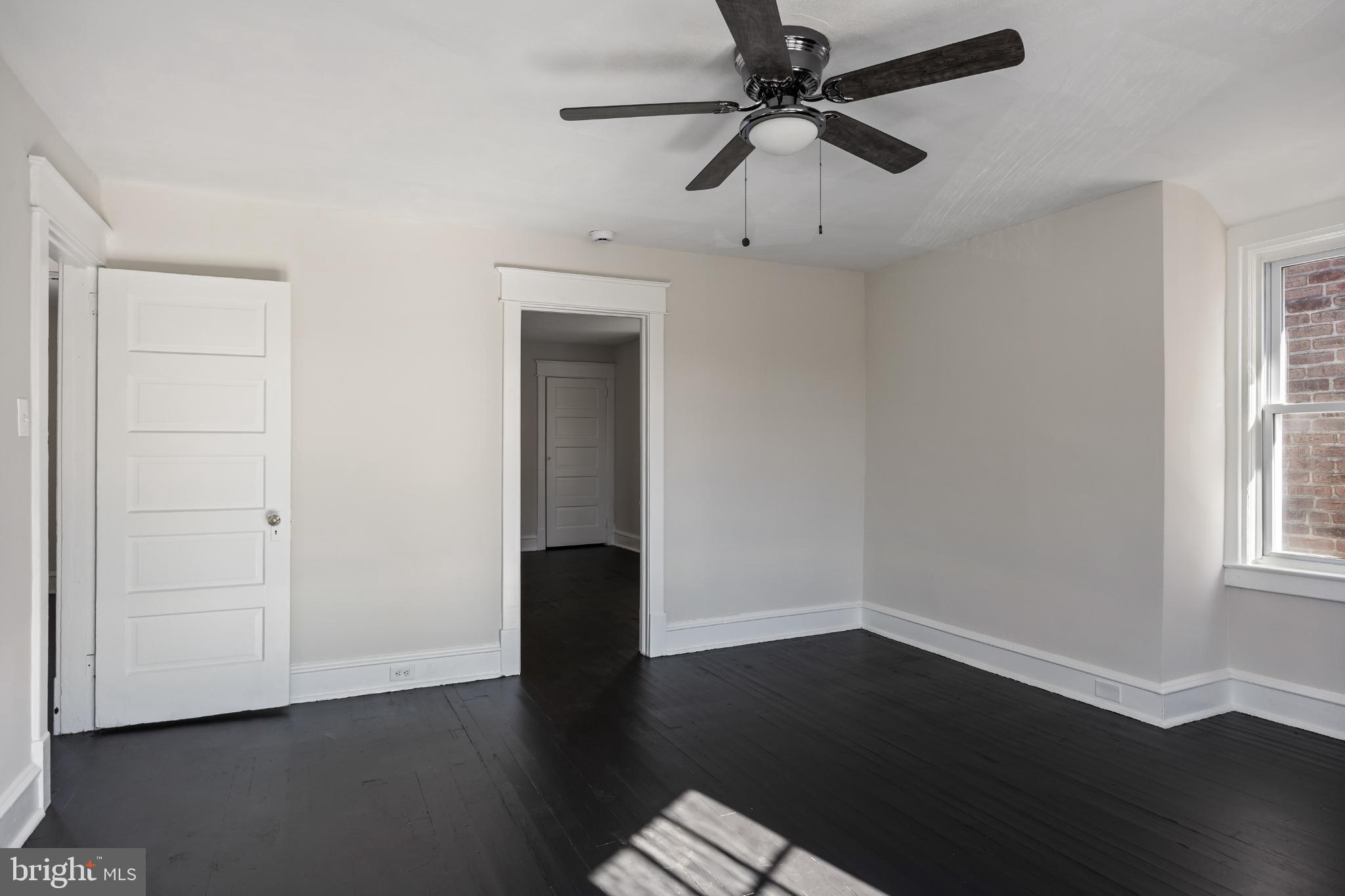 2003 Edgmont Avenue Chester, PA 19013 - Photo 28 of 40 wooden floor in an empty room with a window