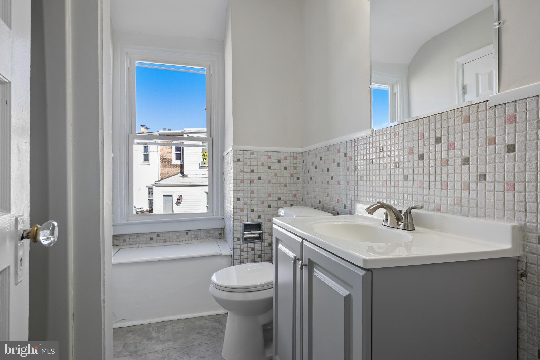 2003 Edgmont Avenue Chester, PA 19013 - Photo 30 of 40 a bathroom with a sink toilet and shower